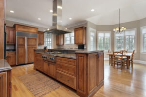 Kitchen in luxury home with wood and granite island