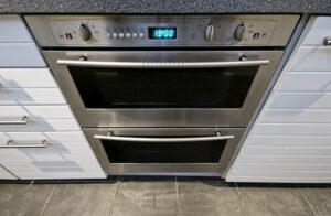 modern domestic stainless steel electric oven with digital displ